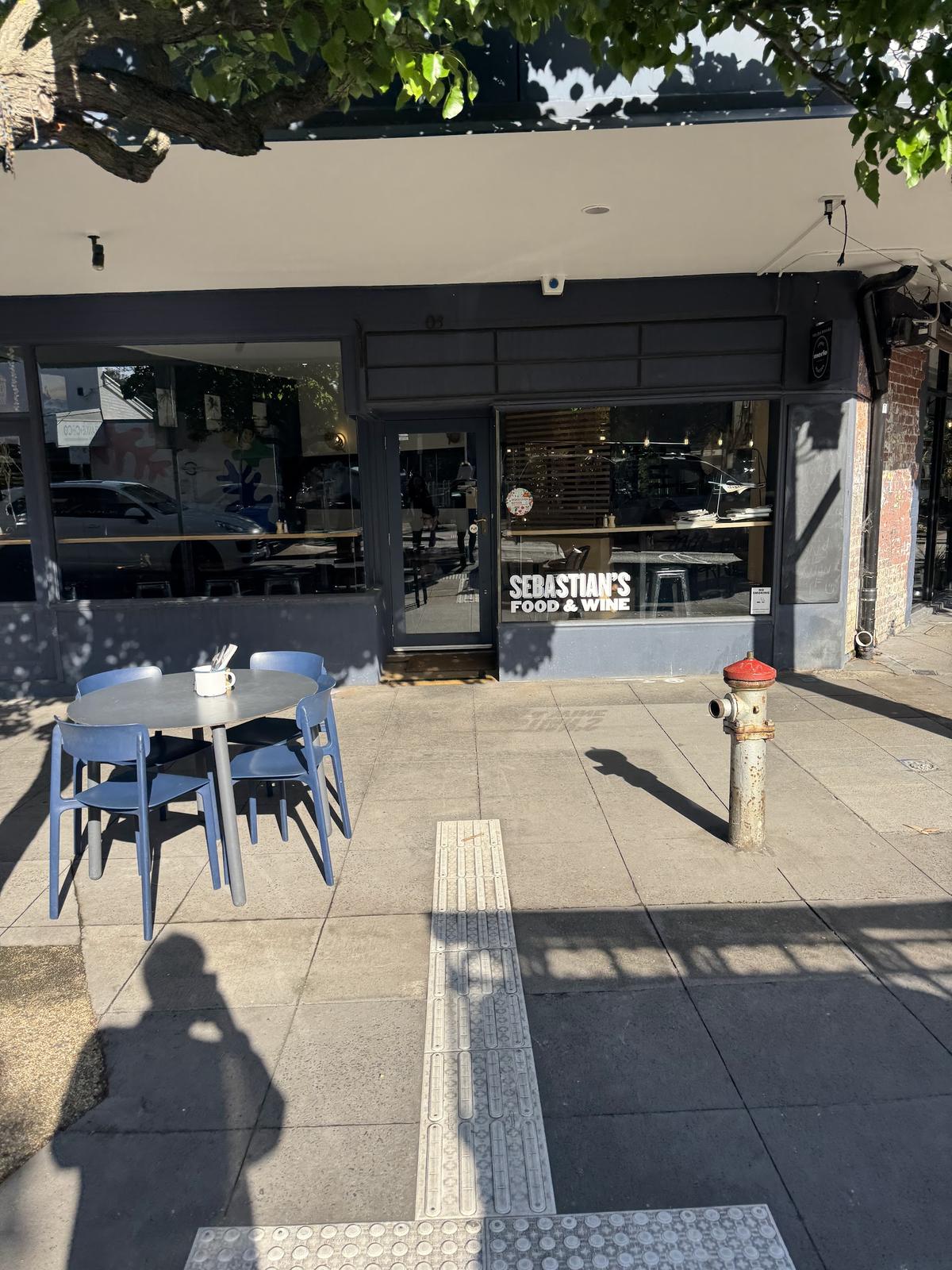 The corner shopfront on Hampton Street, with tables out the front